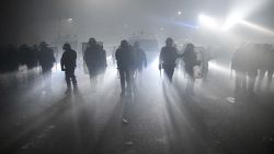 PARIS, FRANCE - NOVEMBER 17: Security forces use tear gas as they intervene in protests against the French Government's proposed global security law bill on November 17, 2020 in Paris, France. The protesters include activists, reporters and unions who are concerned that Article 24 of the bill, which prohibits the diffusion of images of police "with intention to harm", threatens the press freedom in France. Several MPs have criticised the bill's implications and President Macron has come under fire from national journalism unions and the UN for the proposals, relating to police accountability and the use of drones for street surveillance. (Photo by Julien Mattia/Anadolu Agency via Getty Images)