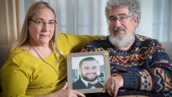 (L-R) Mary Rich and her husband, Joel Rich hold a photo of their son in their home in Omaha, Nebraska, on January 11, 2017. Seth Rich, a 27-year-old staffer for the Democratic National Committee, was killed in the Bloomingdale neighborhood of Washington, D.C., on July 10, 2016. (Photo by Matt Miller for The Washington Post via Getty Images)
