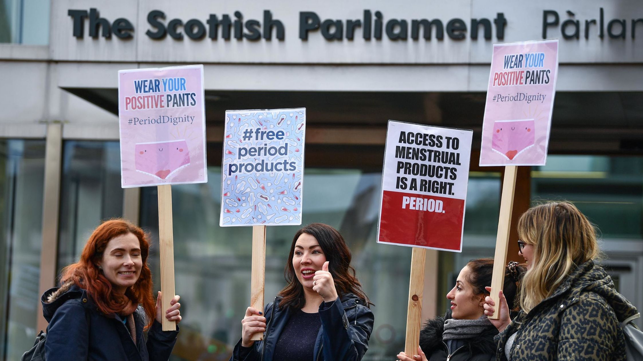 MSP Monica Lennon (second left) with campaigners against period poverty outside Scotland's Parliament in February.
