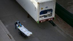 A medical worker wheels the remains of a COVID-19 victim to a mobile morgue at the El Paso County Office of Medical Examiner and Forensic Laboratory on Nov. 9. County Judge Ricardo Samaniego is having to use the mobile morgues and Texas National Guard personnel to deal with a crush of local coronavirus deaths.Syndication El Paso Times