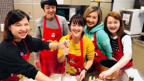 Volunteers cook dinner at a Ronald McDonald House in Taiwan.