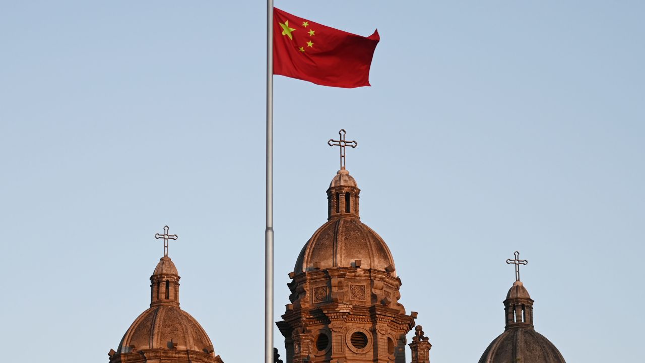 The Chinese national flag flies in front of St Joseph's Church, also known as Wangfujing Catholic Church, in Beijing on October 22, 2020.