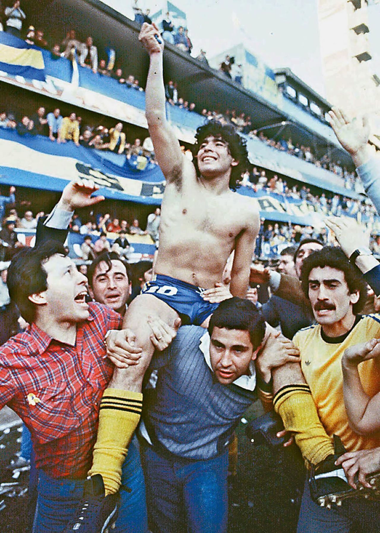 Maradona is carried by fans after leading Buenos Aires club Boca Juniors to a championship in 1981. The next year, Boca Juniors sold Maradona to Spanish club Barcelona for a world-record fee.