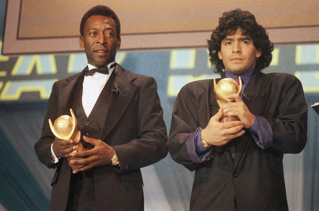 Maradona and Pelé hold "Sports Oscar" trophies in 1987. In 2000, the two split FIFA's Player of the Century award.