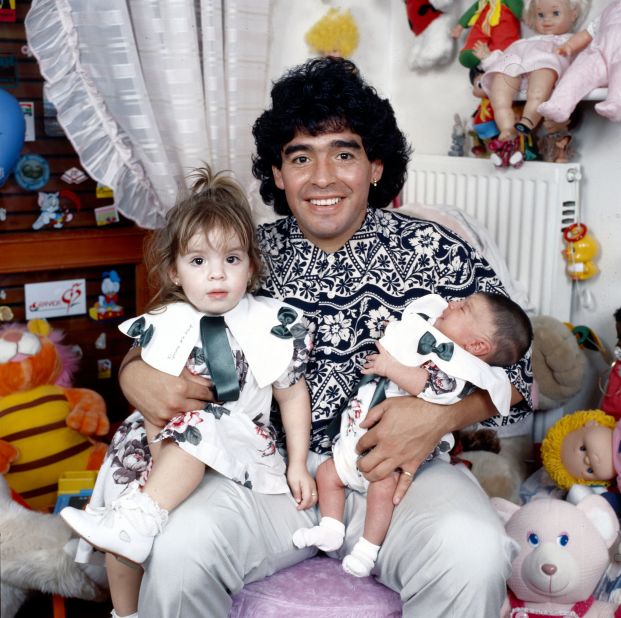 Maradona holds his daughters Dalma and Giannina in 1989.