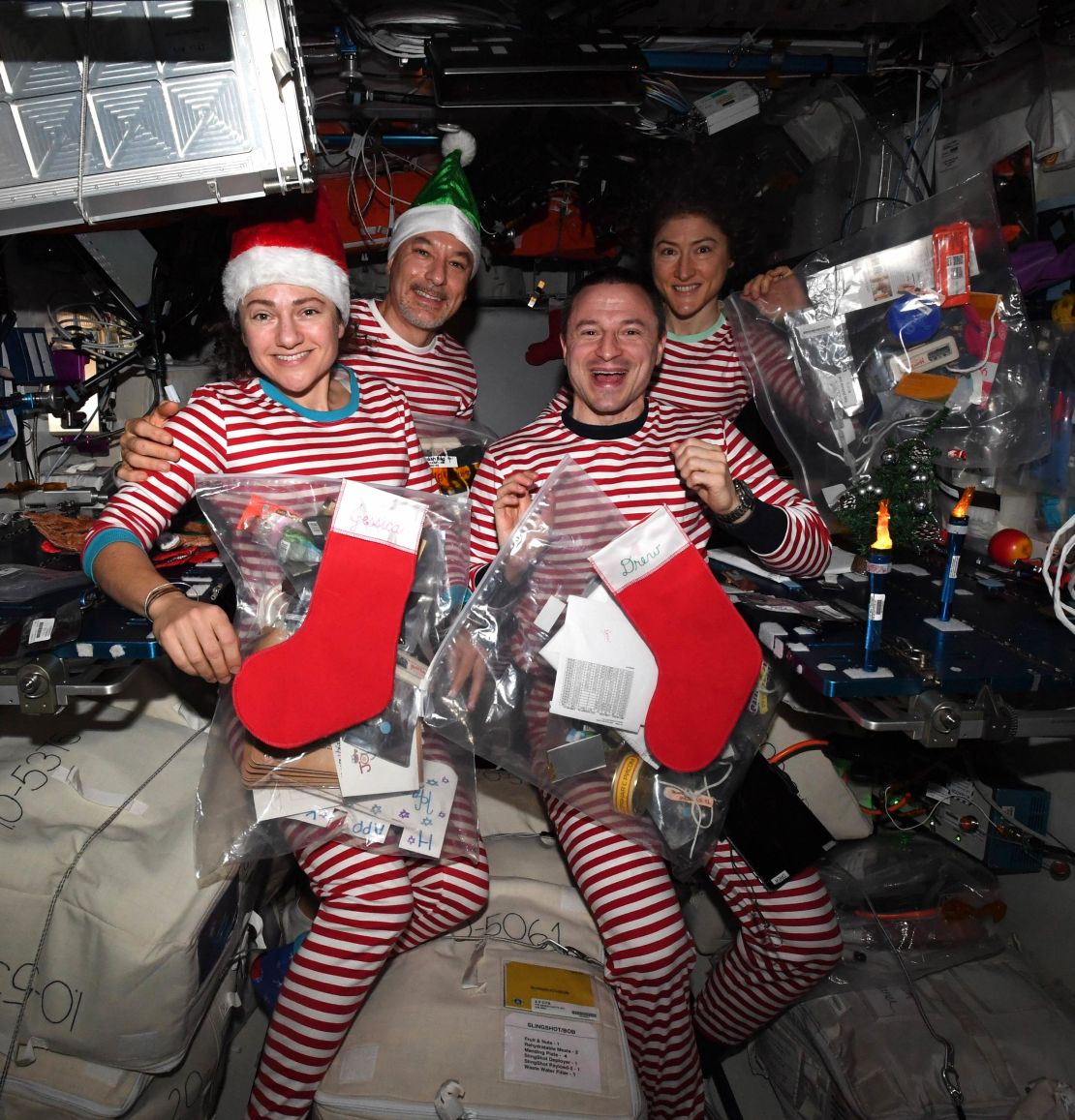 Meir, Parmitano, Morgan and Koch (left to right) celebrate Christmas in space -- in matching pajamas.