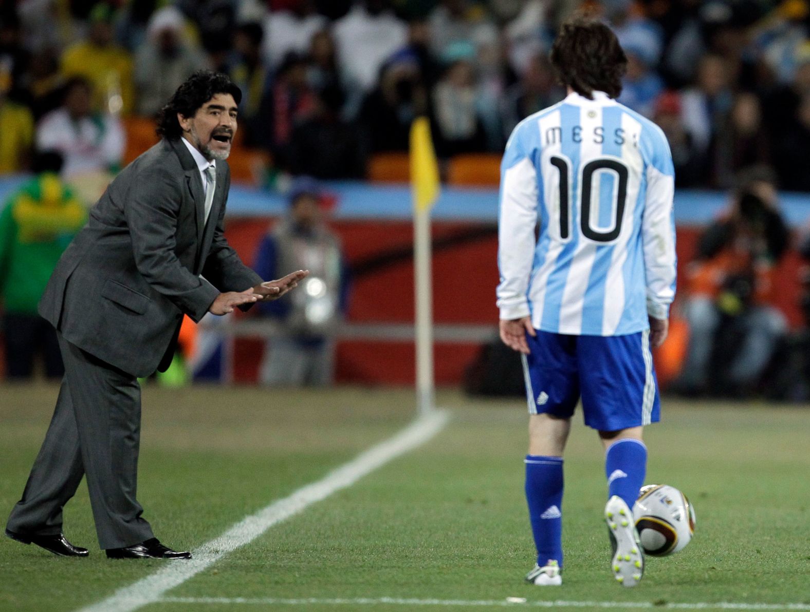 Maradona gives instructions to Argentina star Lionel Messi during a match at the 2010 World Cup.