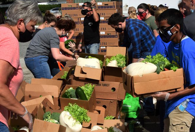 Volunteers distribute turkeys and other foods in Clermont, Florida.