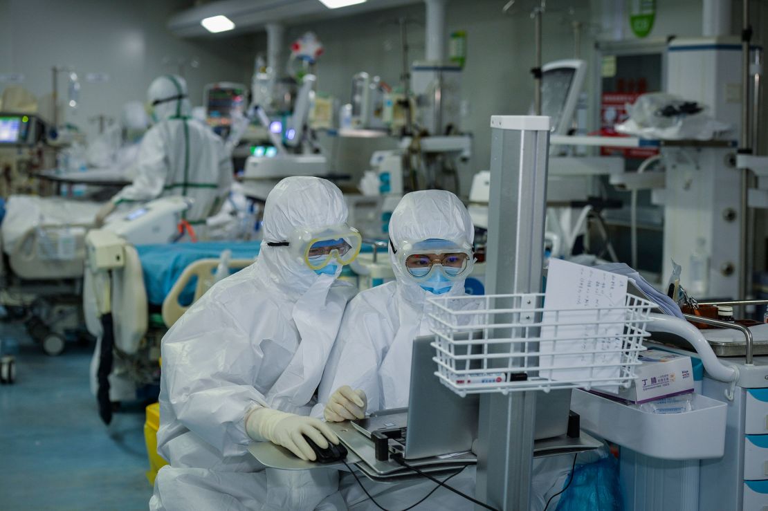 Medical personnel work in the intensive care unit at a Wuhan hospital on February 24.