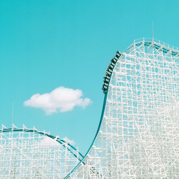 A roller coaster set against blue skies in Kuwana, Japan.