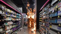 TOPSHOT - Products burn at a supermarket Carrefour in Sao Paulo, Brazil, on November 20, 2020 on Black Consciousness Day after protesters invaded the place during a protest against racism and the death on the eve of a black man who was beaten by white security agents in a supermarket of the same chain in Porto Alegre and who later died. - In Brazil, the last country in the Americas to abolish slavery -- in 1888 -- around 55 percent of the population identifies as black or mixed-race. But although whites earn 74 percent more than people of colour on average, a national debate on racial inequality has only begun relatively recently. (Photo by Nelson ALMEIDA / AFP) (Photo by NELSON ALMEIDA/AFP via Getty Images)