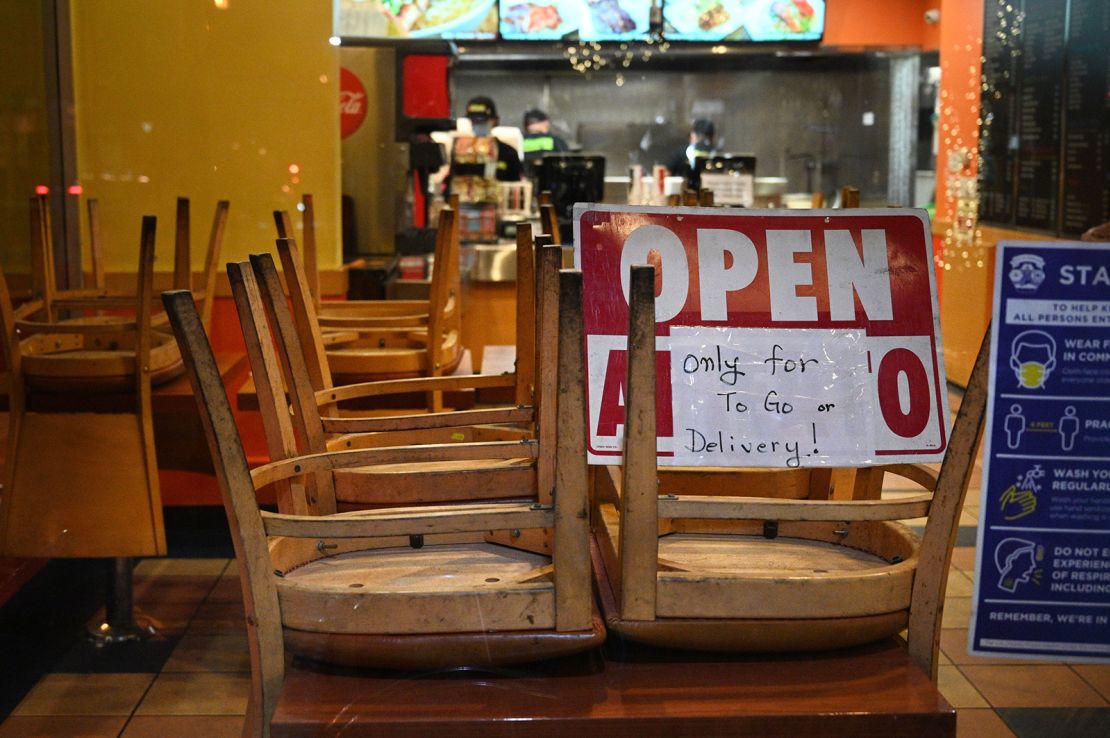 Employees work in a restaurant open for to-go or delivery orders only, in Burbank, California, in November.