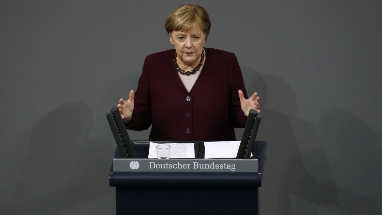 German Chancellor Angela Merkel delivers a government address Thursday at the Bundestag in Berlin on the German government's updated policies to fight the coronavirus pandemic.