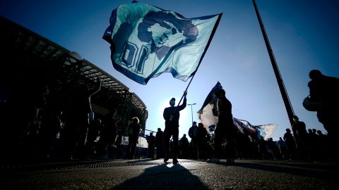 People gather outside the San Paolo stadium in Naples to mourn the death of Maradona.