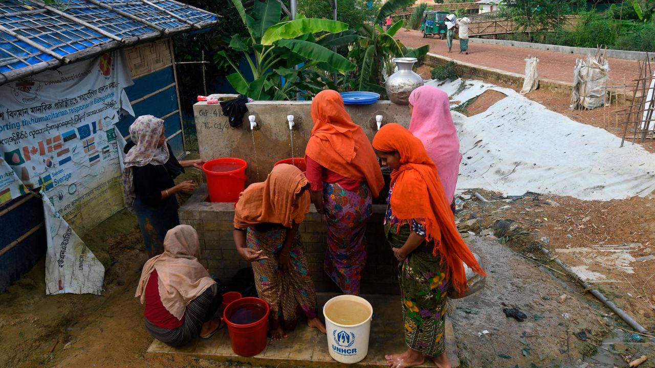 Rohingya refugees collect water in Kutupalong refugee camp, in Ukhia on October 5.