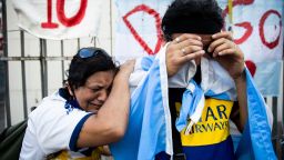 BUENOS AIRES, ARGENTINA - NOVEMBER 26: Fans cry for Diego Maradona after the news of his decease on November 26, 2020 in Buenos Aires, Argentina. Diego Maradona, considered one of the biggest football stars in history, died at 60 from a heart attack on Wednesday in Buenos Aires.  (Photo by Tomas Cuesta/Getty Images)