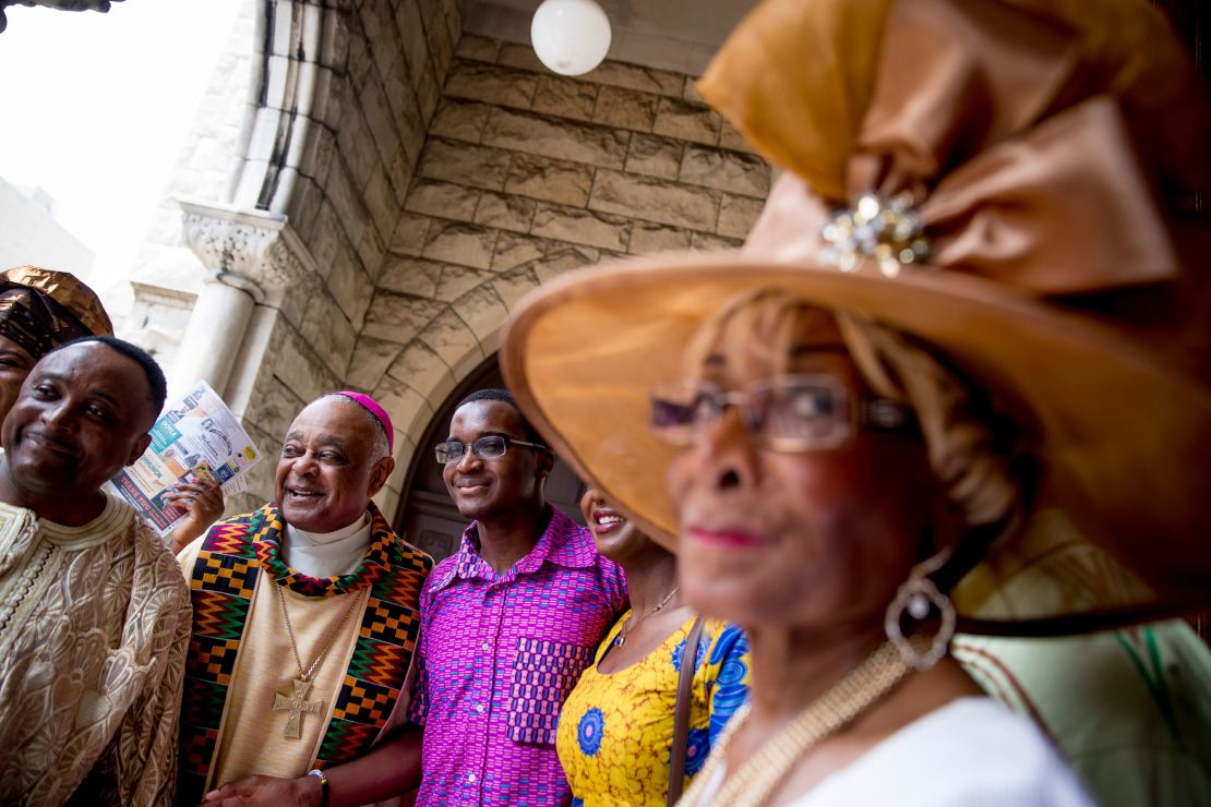 Gregory, second from left, greets parishioners following mass at St. Augustine Church in Washington on June 2, 2019. 