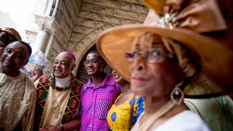 Gregory, second from left, greets parishioners following mass at St. Augustine Church in Washington on June 2, 2019. 