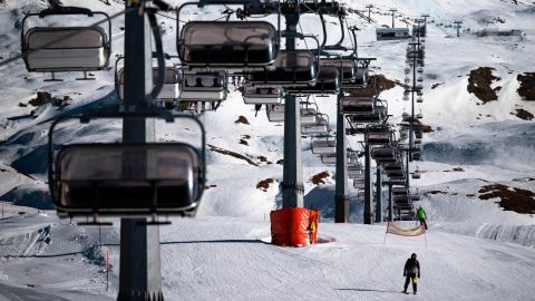 A professional athlete skis by chairlifts on Plan Maison ski run in the alpine ski resort of Breuil-Cervinia, Northwestern Italy, on November 25, 2020. - Closed shops, hotels and restaurants: Italy's ski resorts look like dead towns and their hopes of reopening before Christmas are now almost nil, causing concern and disarray, while neighbouring Switzerland has reopened its slopes. (Photo by Marco Bertorello / AFP) (Photo by MARCO BERTORELLO/AFP via Getty Images)