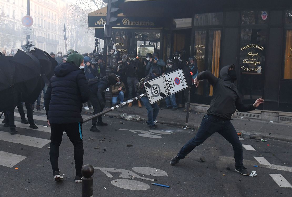 Demonstrators clash with police during a protest against the "global security" draft law in Paris, on Saturday, November 28, 2020.