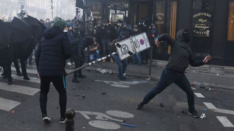 Demonstrators clash with police during a protest against the "global security" draft law in Paris, on Saturday, November 28, 2020.