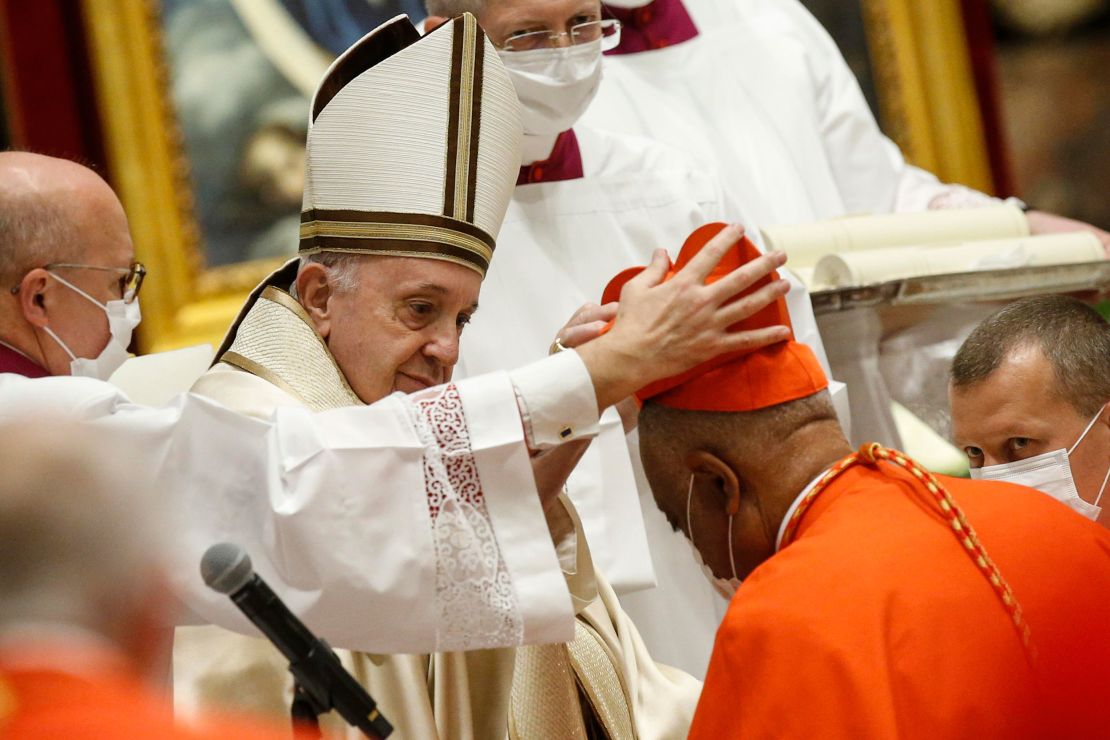 Wilton Gregory receives his biretta from Pope Francis at St. Peter's Basilica in The Vatican on Saturday.
