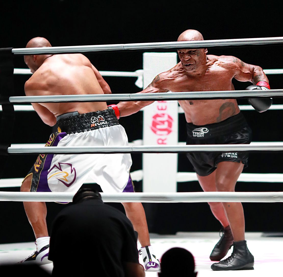 Mike Tyson throws a punch in the fourth round against Roy Jones Jr. 