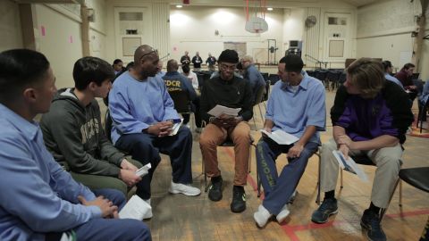 Sy Green, center, and Jason Bryant, right, participate in the reading group.