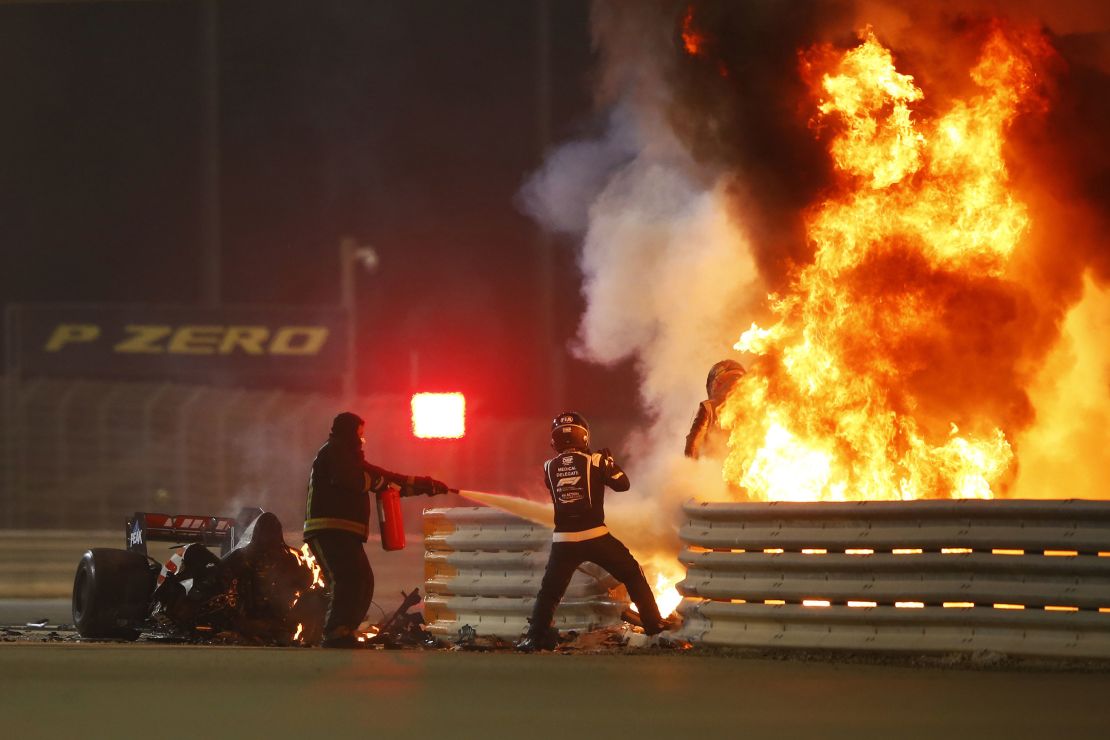 Romain Grosjean emerges from the flames of the crash.