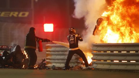 Romain Grosjean emerges from the flames of the crash.