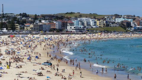 People gather at Bondi beach in Sydney, Australia on Saturday as temperatures soar past 40 degrees Celsius (104 degrees Fahrenheit).