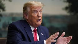 President Donald Trump speaks with reporters after participating in a video teleconference call with members of the military on Thanksgiving, Thursday, Nov. 26, 2020, at the White House in Washington. (AP Photo/Patrick Semansky)