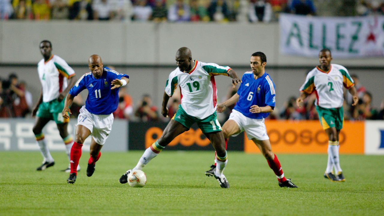 Diop playing in Senegal's shock victory over France at the 2002 World Cup.