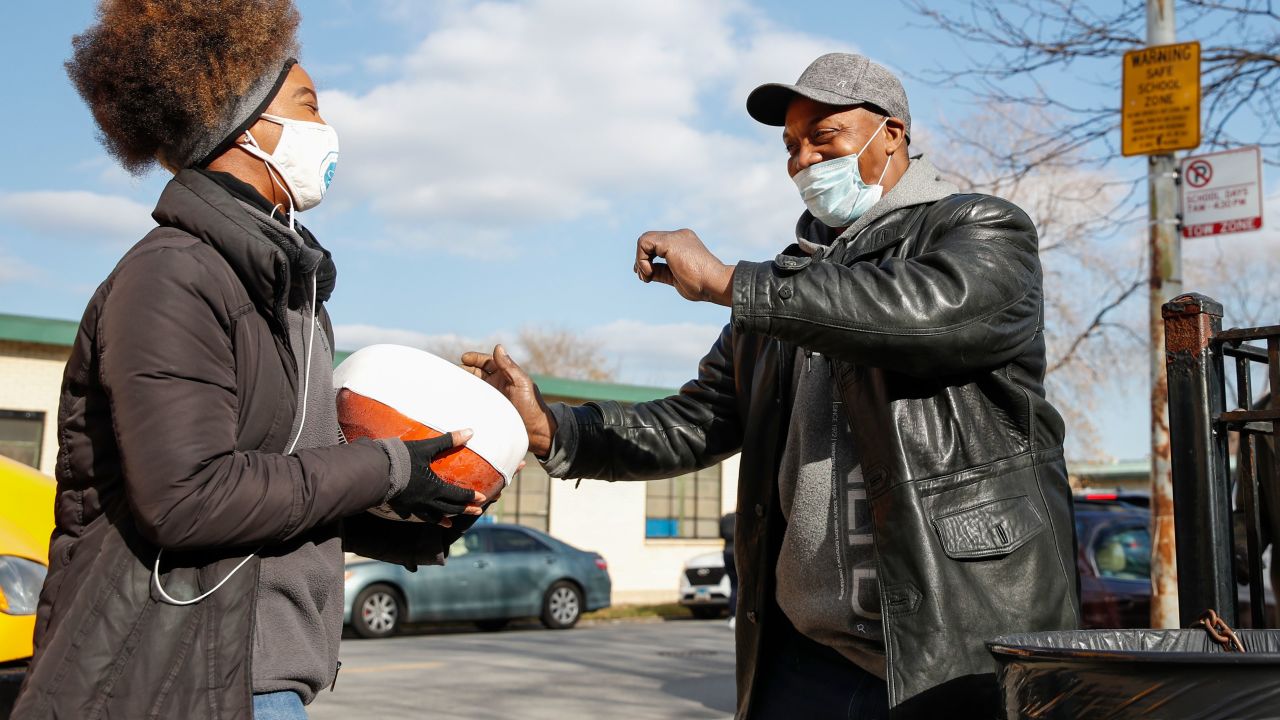 Volunteers distribute free turkeys to those in need on behalf of Chance The Rapper charitable foundation SocialWorks ahead of the Thanksgiving holiday in Chicago, Illinois, on November 23, 2020.