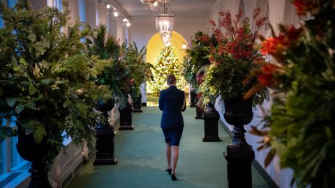 A military aide walks through the East Colonnade as it is decorated for Christmas at the White House on November 30, 2020. 