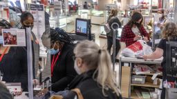 JCPenney employees checkout customers while following COVID-19 guidelines. Black Friday Shopping in Maumee, US - 27 Nov 2020 (Stephen Zenner/SOPA Images/Shutterstock)