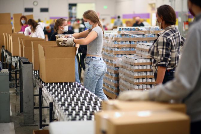 Volunteers in Denver work at the Food Bank of the Rockies on November 25.