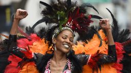 Rochelle Westbrooks, of Sacramento, raises her arms as she dances during the Black Joy Parade in Oakland, Calif., on Sunday, Feb. 24, 2019. (Jose Carlos Fajardo/Bay Area News Group)