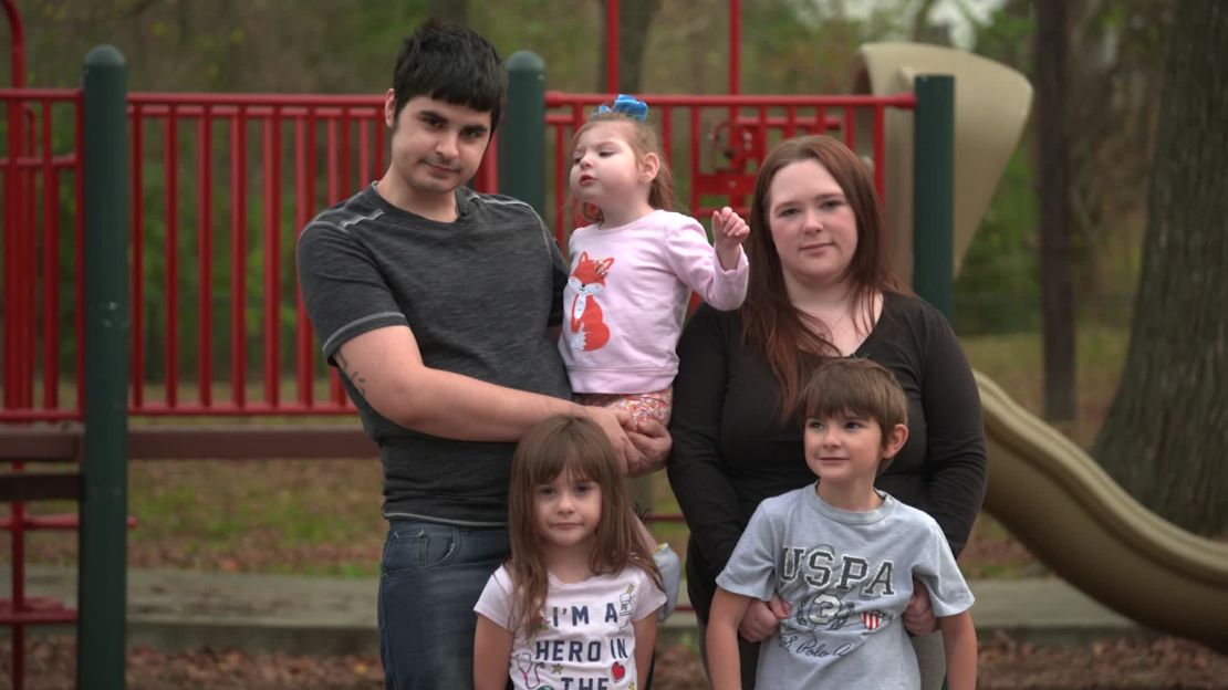 Jessica Lusk and Dylan Garcia stand with their children Brandi (3), Isabella (5), and Elijah (6).