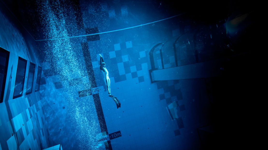 Divers take the plunge at the world's deepest swimming pool, which launched in Poland last month.