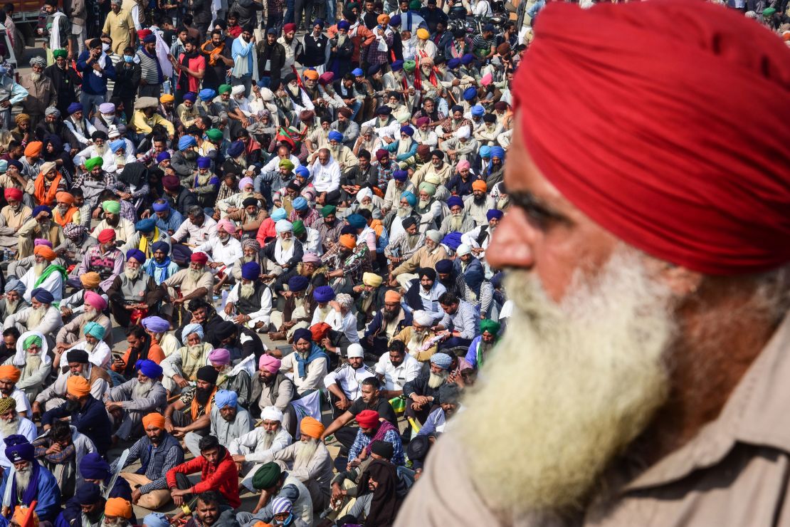 Farmers gather near a police road block stopping them from marching to New Delhi during a demonstration on November 30, 2020.