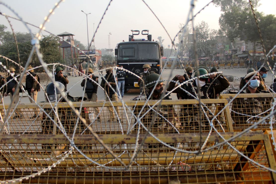 Security personnel deployed to stop farmers from entering the national capital during a protest against the Centre's new farm laws at Singhu border near Delhi, India on November 30, 2020. 