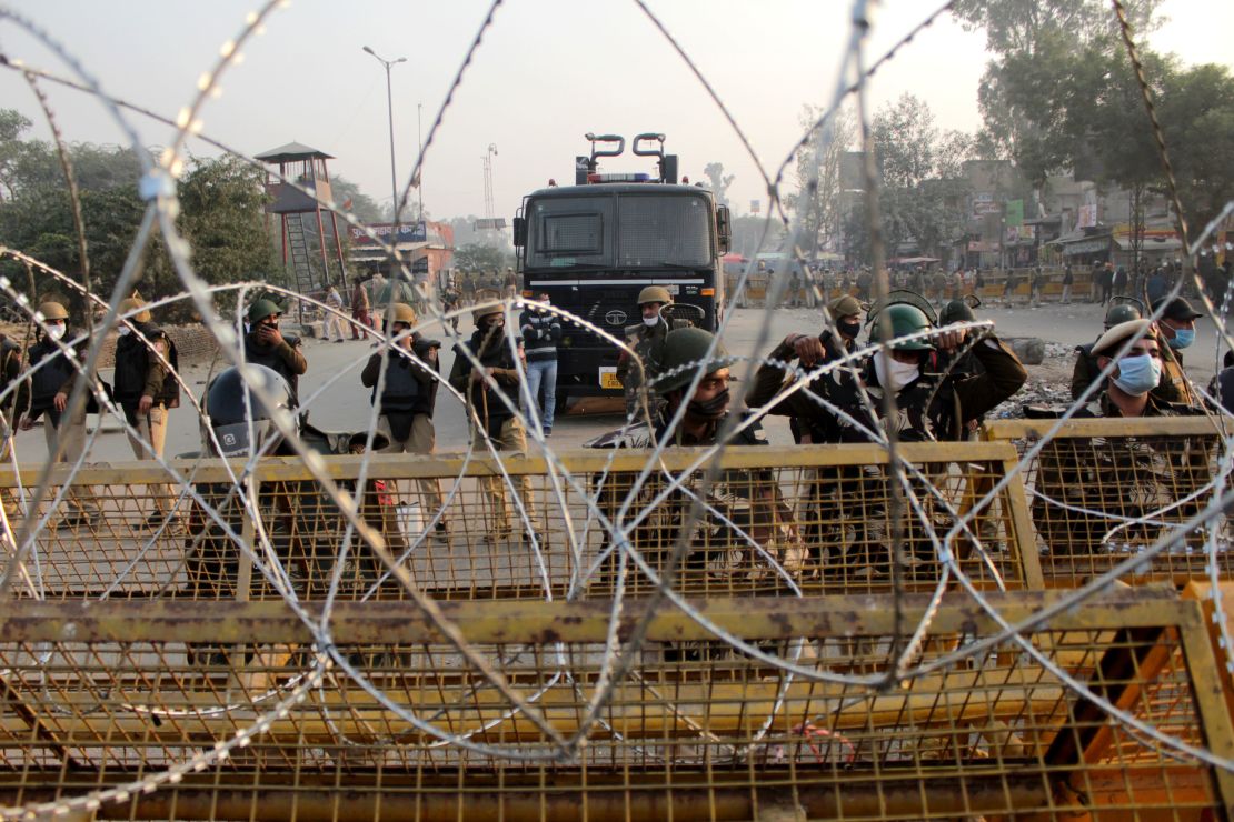 Security personnel deployed to stop farmers from entering the national capital during a protest against the Centre's new farm laws at Singhu border near Delhi, India on November 30, 2020.