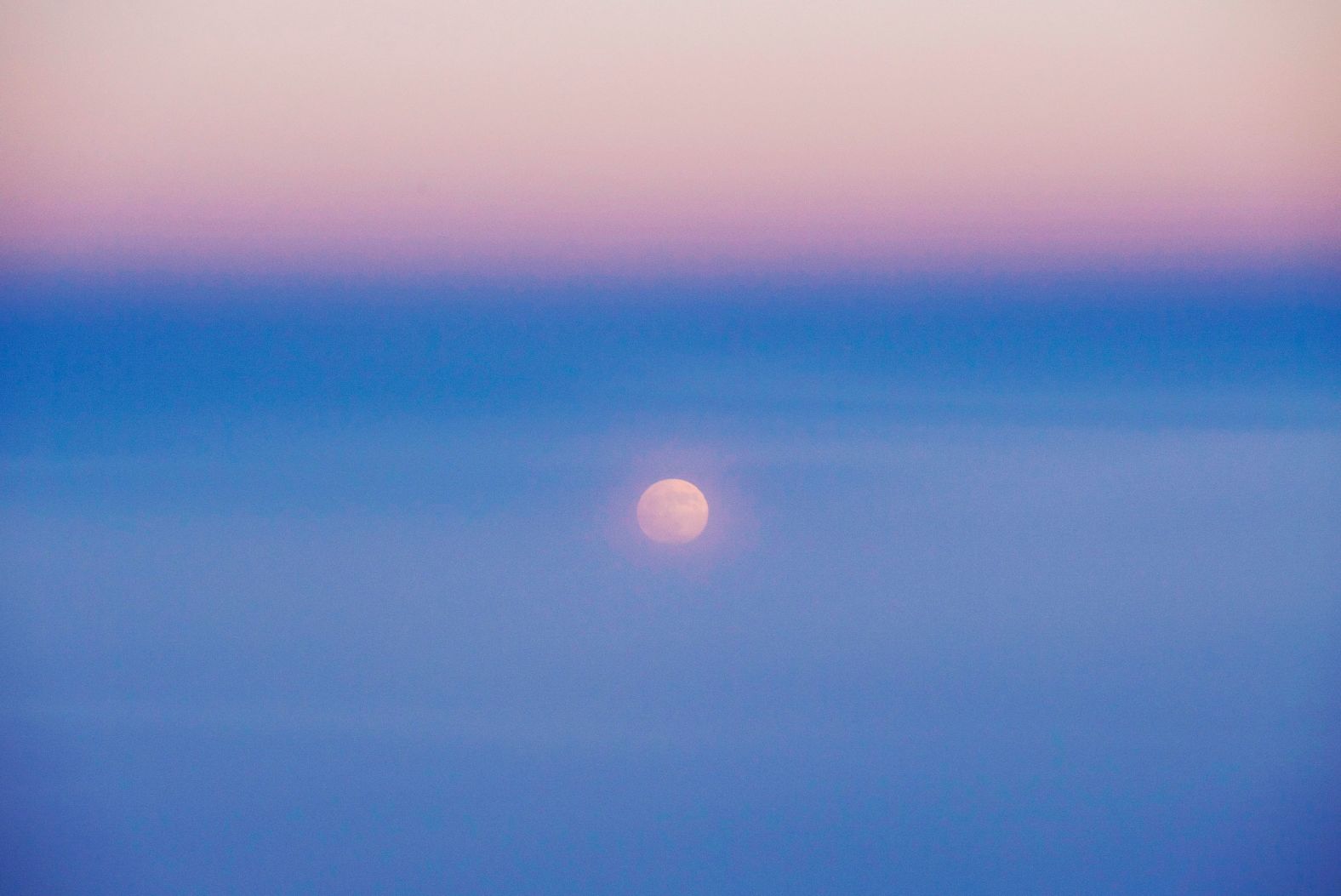 Shown is the moon as seen from Air China Flight CA4105 from Chengdu to Beijing during the penumbral lunar eclipse.