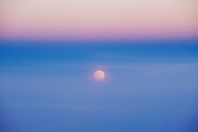 Shown is the moon as seen from Air China Flight CA4105 from Chengdu to Beijing during the penumbral lunar eclipse.