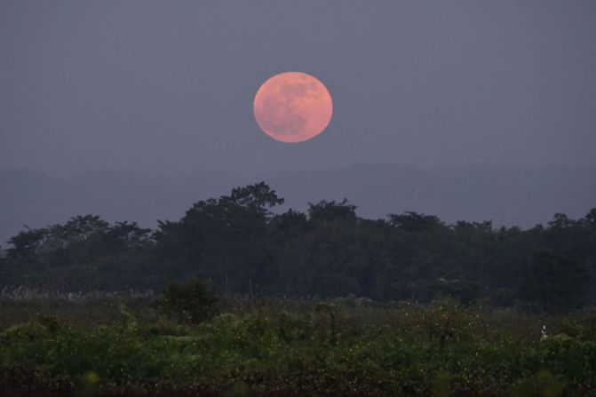 A view of the moon is shown on the auspicious festival day of Kartik Purnima in Assam, India.