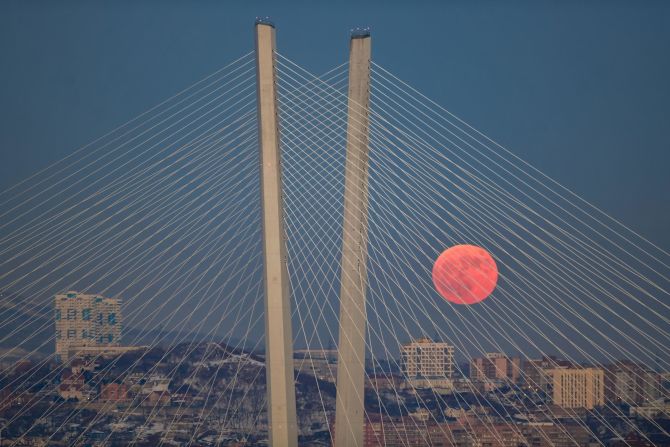 The moon gleams over Russia's Russky Bridge, which spans the Eastern Bosphorus Strait.