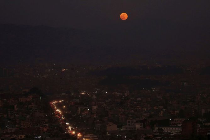 The full moon is shown above the valley in Kathmandu, Nepal, November 30.