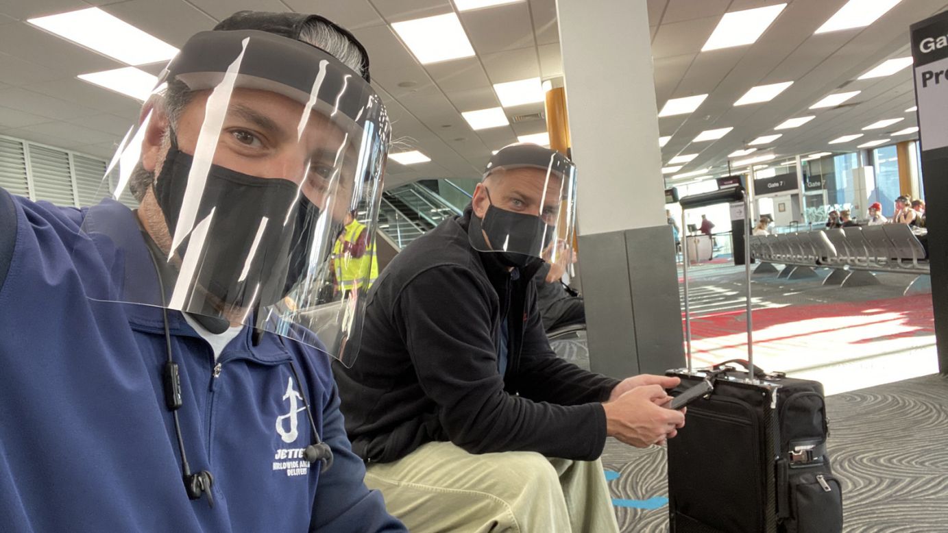 <strong>Face shields:</strong> Steve Giordano and Captain Chris Heber in Auckland NZ preparing to board Qatar Airlines for a flight home to JFK via Doha, Qatar. The airline issued the face shields, which are now mandatory during its flights.