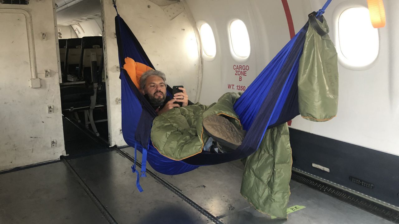 <strong>Rest break:</strong> Steve Giordano takes a rest break in the cargo area of a DHC-8-200 in a makeshift hammock in Baku, Azerbaijan, enroute to Bagram in Afghanistan.